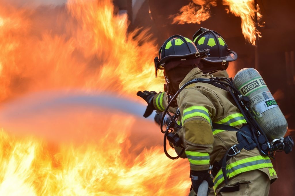 fire fighters with a massive fire