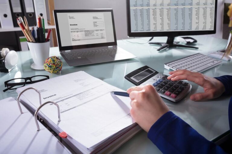 landlord looking over an invoice to use in accounting software for property management