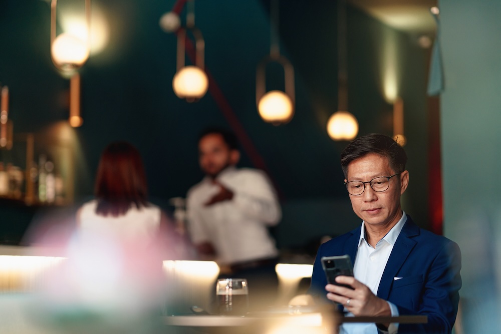 Investor looking over a Landlord Studio review on his phone